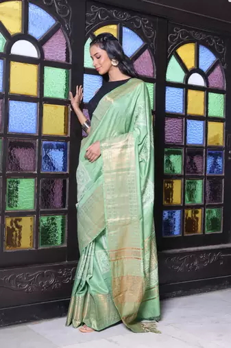 Sap green silk soft saree with zari borders