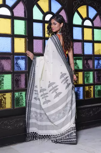 Off white cotton handwoven saree with texture borders