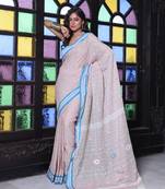 Ecru cotton handwoven saree with floral buttas