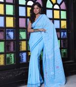 Sky blue cotton handwoven saree with floral buttas