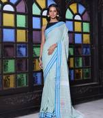 Pistachio green cotton handwoven saree with floral buttas