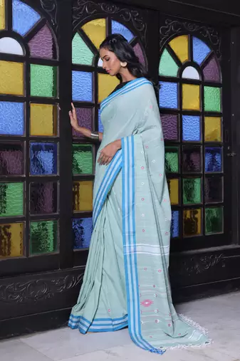 Pistachio green cotton handwoven saree with floral buttas