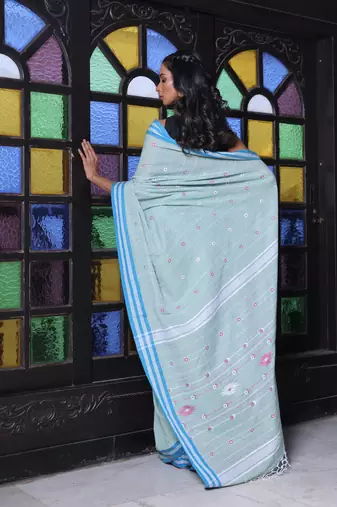 Pistachio green cotton handwoven saree with floral buttas