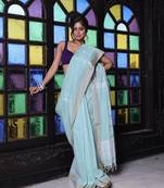 Pistachio green cotton handwoven saree with texture motifs