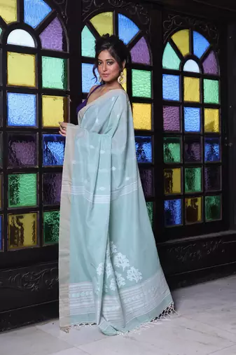 Pistachio green cotton handwoven saree with texture motifs
