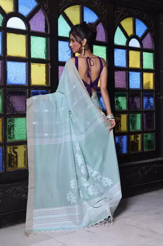 Pistachio green cotton handwoven saree with texture motifs