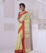 Lemon yellow cotton handwoven saree with floral buttas