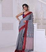 Grey cotton handwoven saree with floral buttas