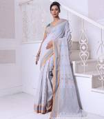 Ecru cotton handwoven saree with floral buttas