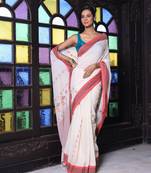 Beige cotton handwoven saree with floral buttas
