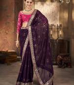 Wine purple saree in georgette with embroidered  border and floral buttis along with unstitched blouse