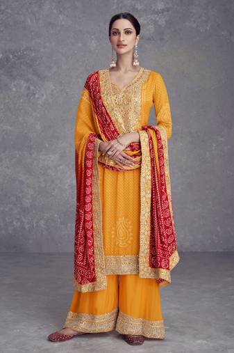 Mustard embroidered chinnon free size stitched straight palazzo suit. ( size upto 42)