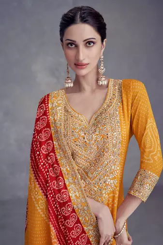 Mustard embroidered chinnon free size stitched straight palazzo suit. ( size upto 42)
