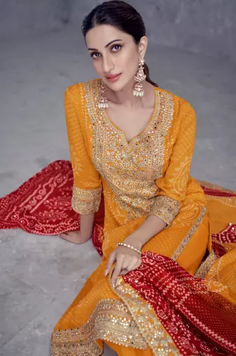 Mustard embroidered chinnon free size stitched straight palazzo suit. ( size upto 42)
