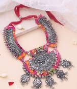 Oxidised statement necklace with work on vibrant pink fabric
