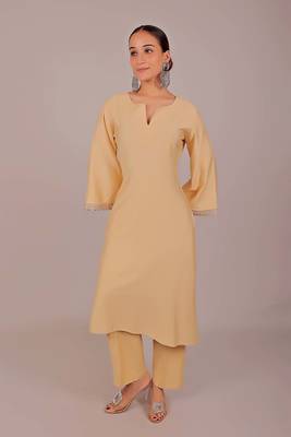 Women's beige kurti pajama set - embroidery patch on sleeve 1