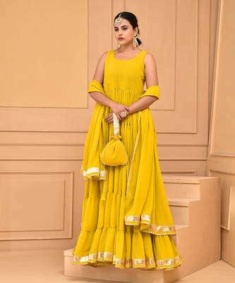Mustard floor length tiered anarkali  paired with dupatta and potli bag 1