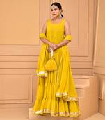 Mustard floor length tiered anarkali  paired with dupatta and potli bag