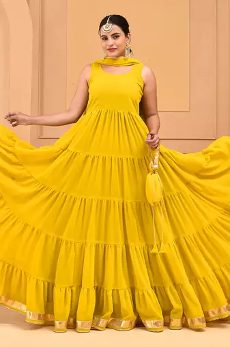Mustard floor length tiered anarkali  paired with dupatta and potli bag