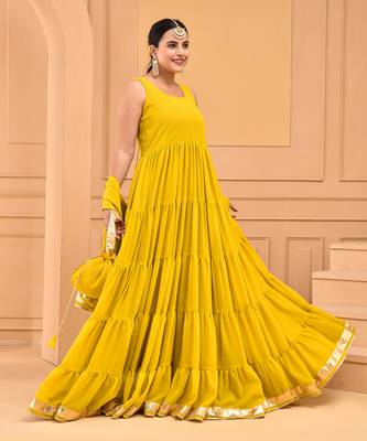 Mustard floor length tiered anarkali  paired with dupatta and potli bag 3