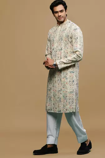 Sanwara men's printed orange & blue chikankari kurta & salwar set with sequin accents.
