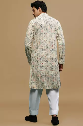 Sanwara men's printed orange & blue chikankari kurta & salwar set with sequin accents.