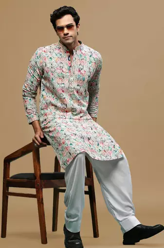 Sanwara men's printed pink & blue chikankari kurta & salwar set with sequin accents.