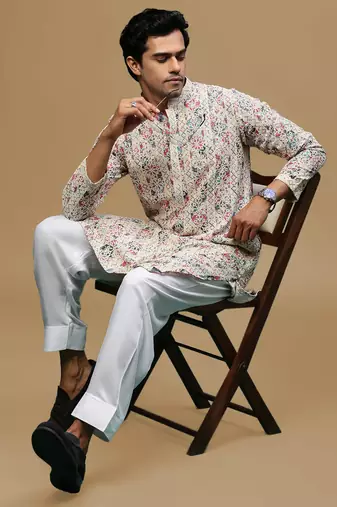 Sanwara men's printed red & blue chikankari kurta & salwar set with sequin accents.