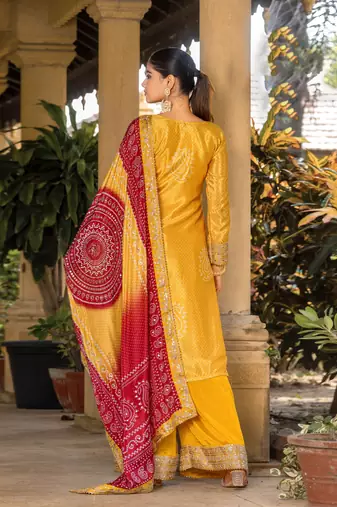 Yellow chinon bandhani printed heavy salwar kameez with jari and mirror embroidery work