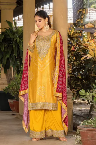 Yellow chinon bandhani printed heavy salwar kameez with jari and mirror embroidery work