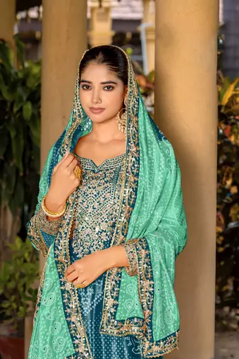 Teal chinon bandhani printed heavy salwar kameez with jari and mirror embroidery work
