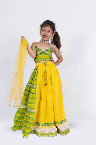 Twisha strppy crisscrossed  frilled top with ghagra set - orange & pink