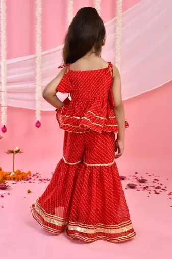 Girl's red peplum kurta sharara set