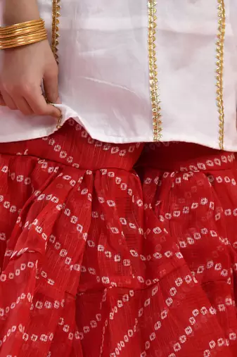 Girl's white and red kurta sharara set with dupatta