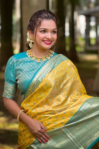 Yellow kanjivaram tissue silk traditional zari woven saree