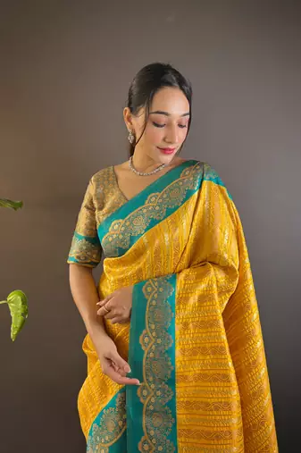 Yellow contrast zari woven silk saree with satin unique border