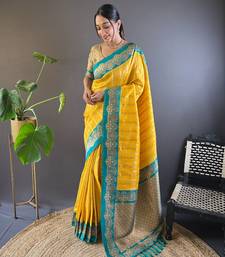 Yellow contrast zari woven silk saree with satin unique border