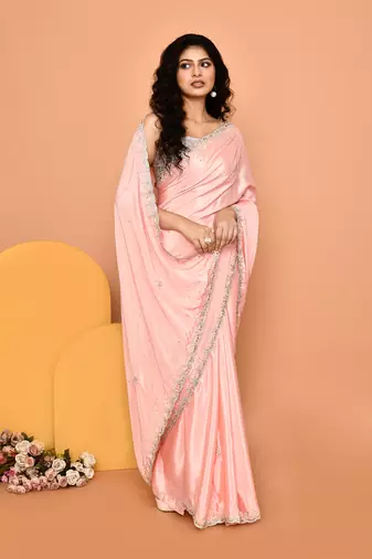 Alluring peach color designer handwork saree