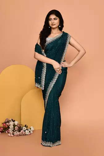 Mesmerizing turquoise color designer handwork saree