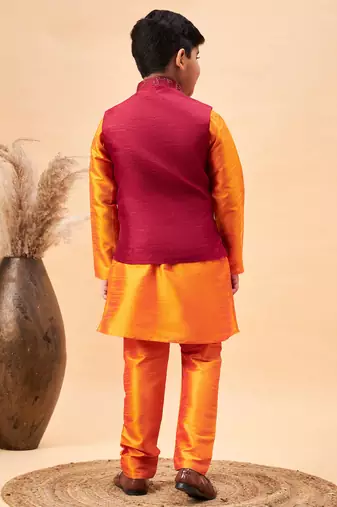 maroon nehru jacket and orange kurta and pyjama set