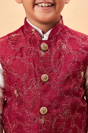 maroon nehru jacket,and white  kurta and pyjama set