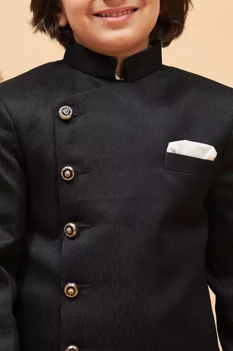 cream and black sherwani set