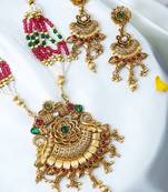 Gold plated antique floral motif emerald studded temple jewellery set
