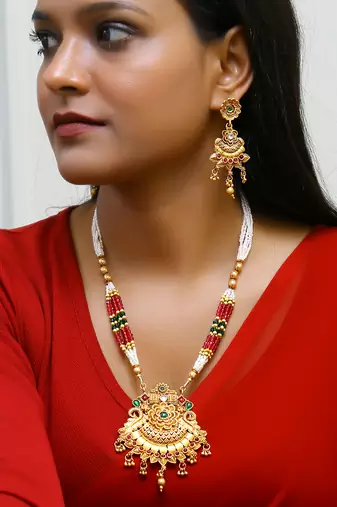Gold plated antique floral motif emerald studded temple jewellery set