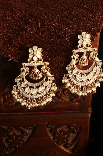 Gold plated kundan studded peacock earrings
