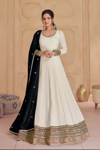 White embroidered georgette free size stitched gown.
