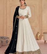 White embroidered georgette free size stitched gown.