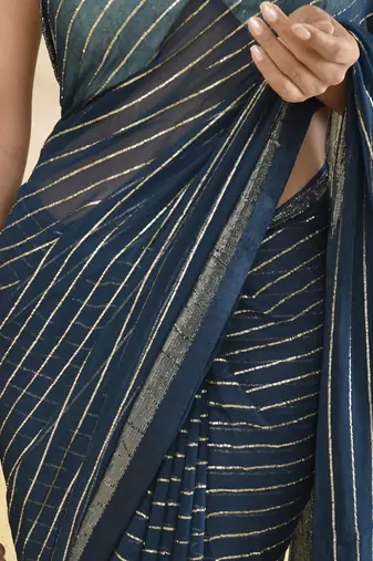 Blue zari striped saree with heavy bordered and unstitched blouse