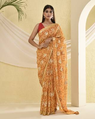 Yellow bandhani and zari work saree with unstitched blouse fabric 1