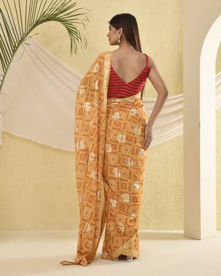 Yellow bandhani and zari work saree with unstitched blouse fabric 2